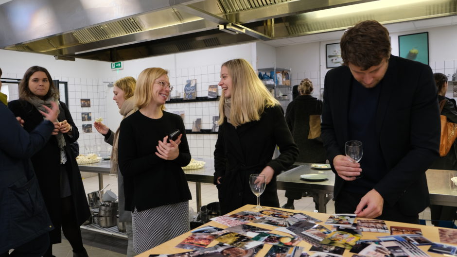 Emily and other guests at the Photovoice exhibition